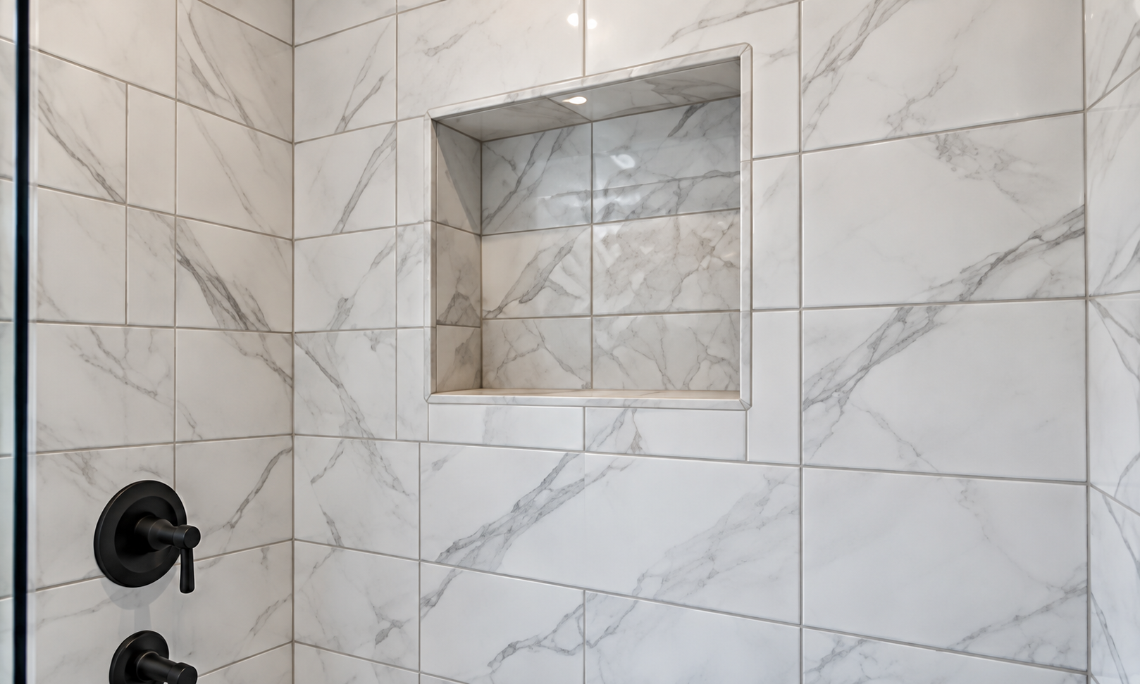 Marble-style shower tiles and black fixtures